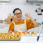 Small business owner creating a video of baked goods for content marketing