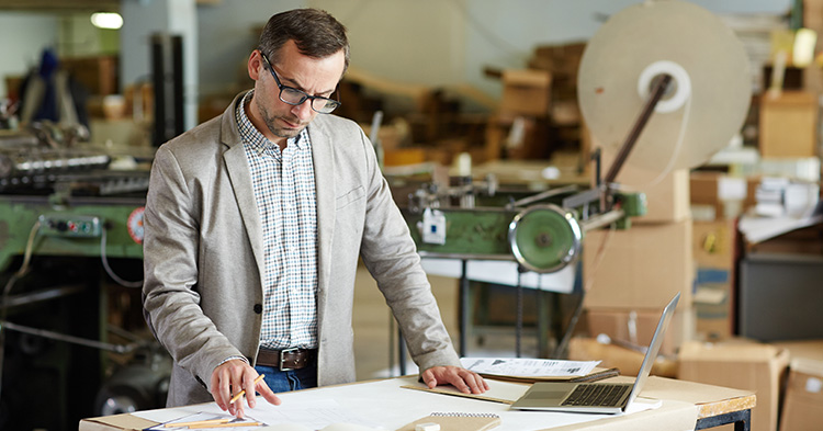 Man looking at document.