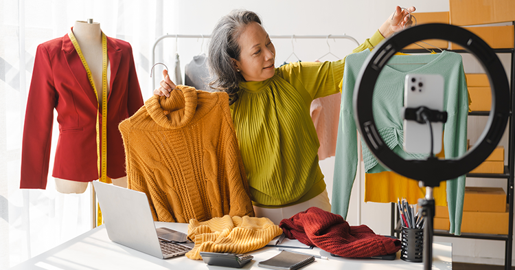 Fashion business women setting up photoshoot for her items